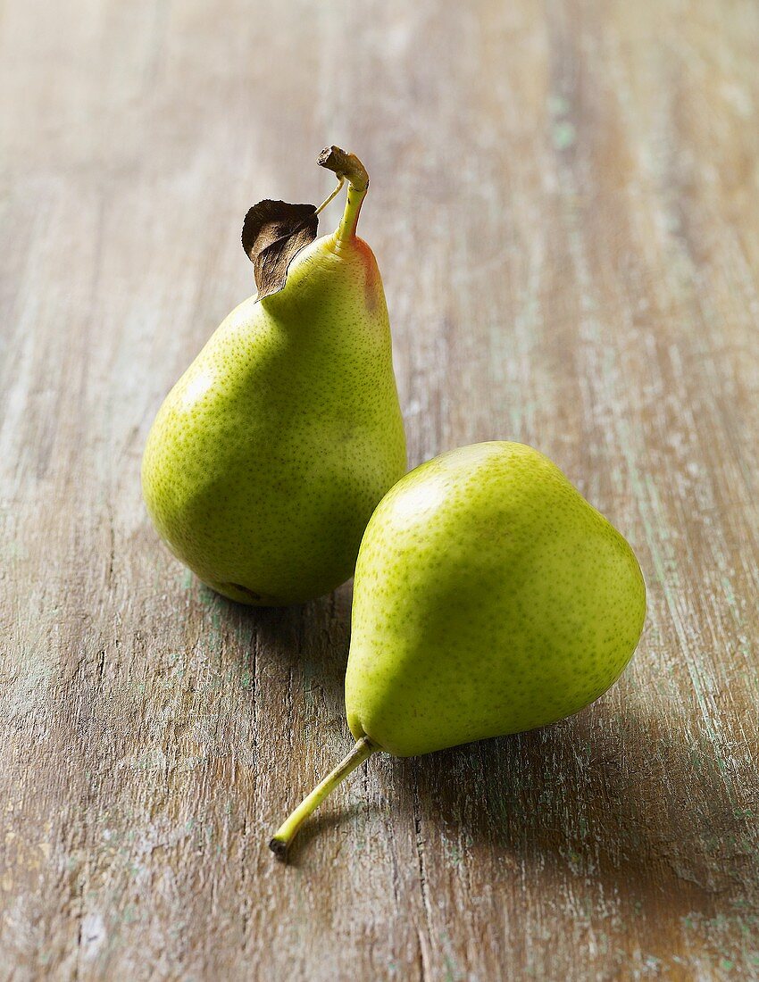 Two Bartlet Pears on Wooden Surface