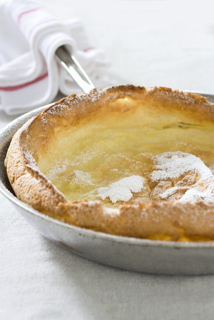 Dutch Baby in a Skillet with Powdered Sugar