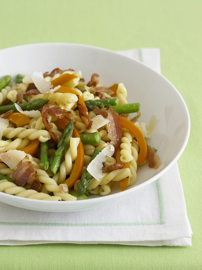 Gemelli Pasta with Veggies and Prosciutto in a White Bowl