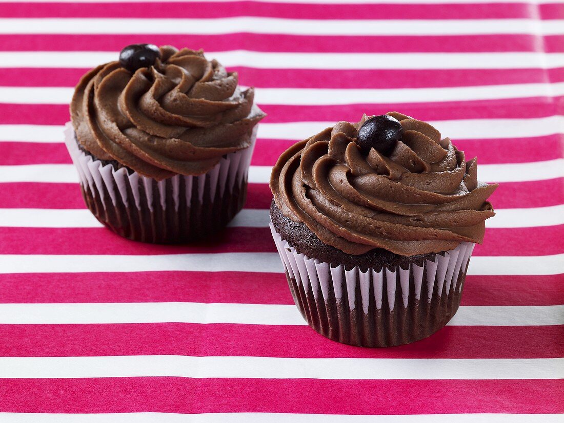 Two Mocha Cupcakes with Chocolate Covered Coffee Beans