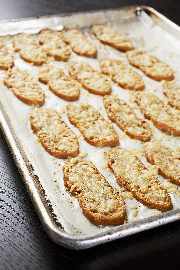 Parmesan croutons on a baking tray