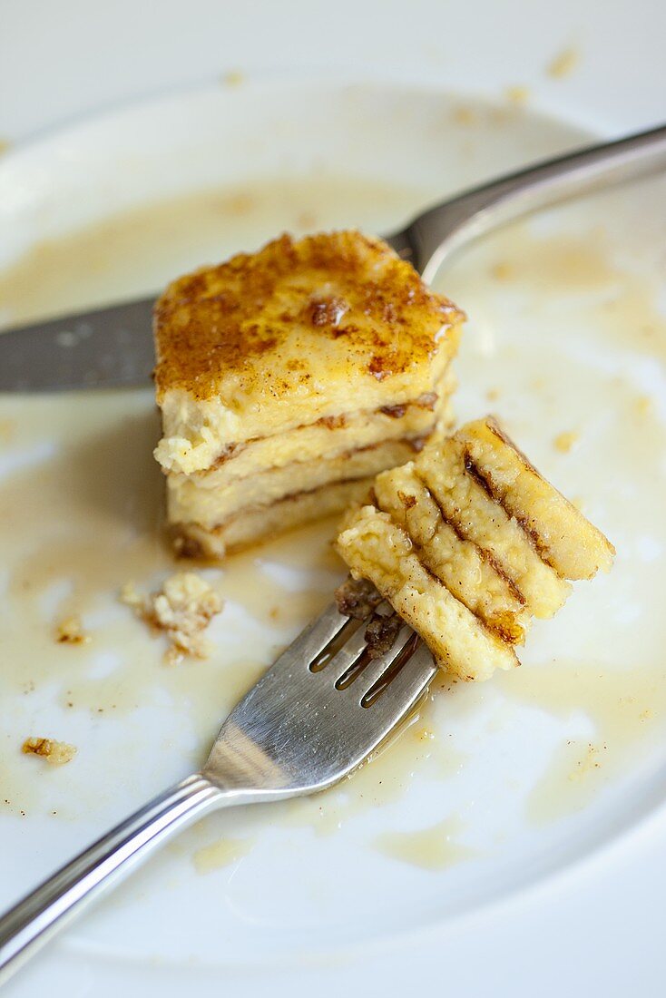 Small Piece of French Toast Left on Plate with Some on Fork