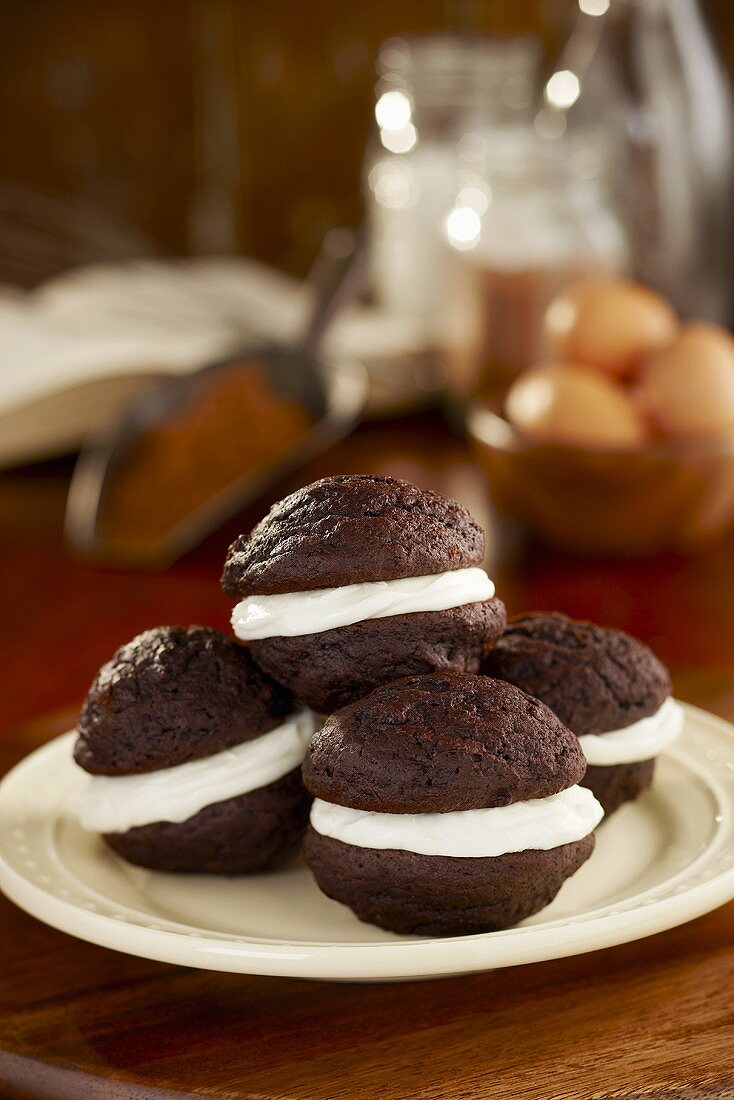 Homemade Whoopie Pies on a Plate; Ingredients in Background
