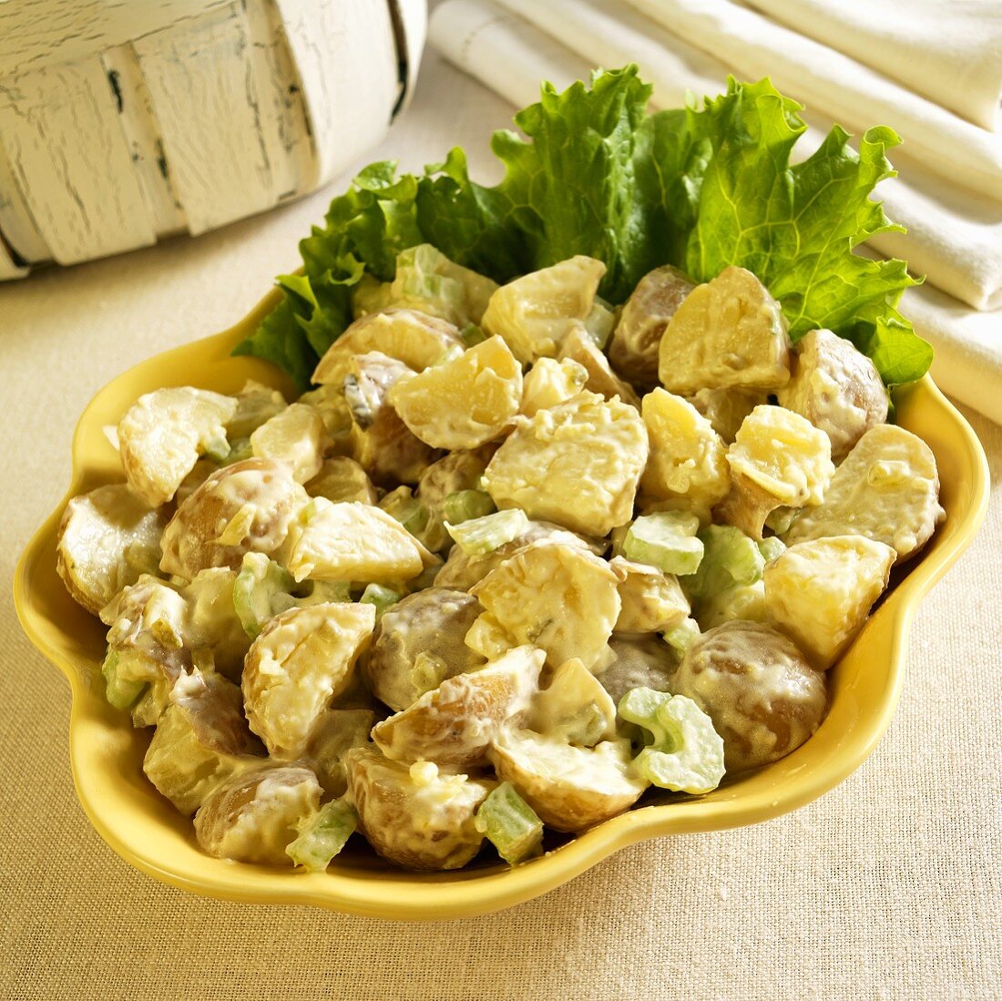 Potato Salad in a Serving Bowl with Lettuce Garnish