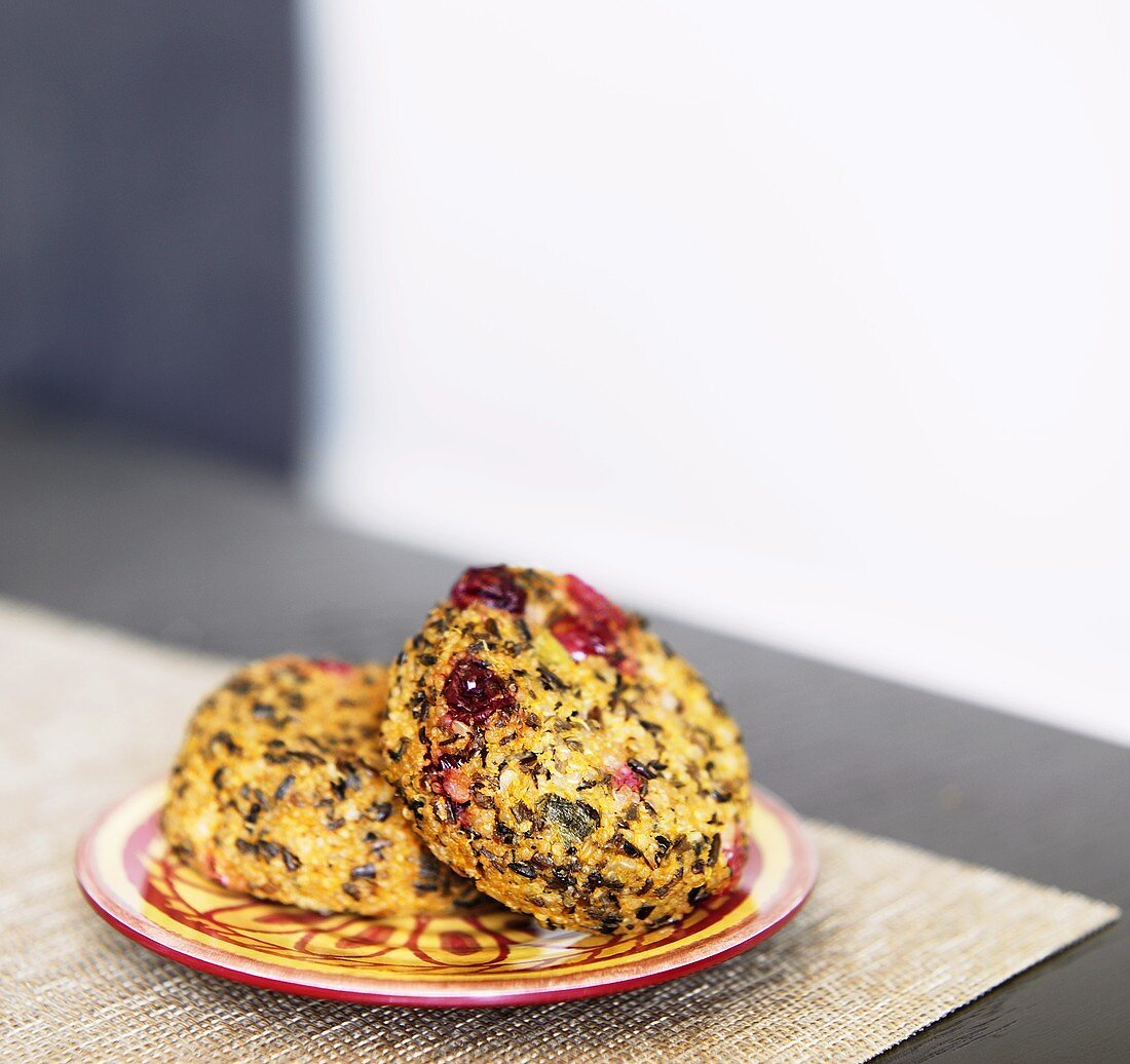 Two Sweet Potato and Cranberry Quinoa Cakes on a Plate