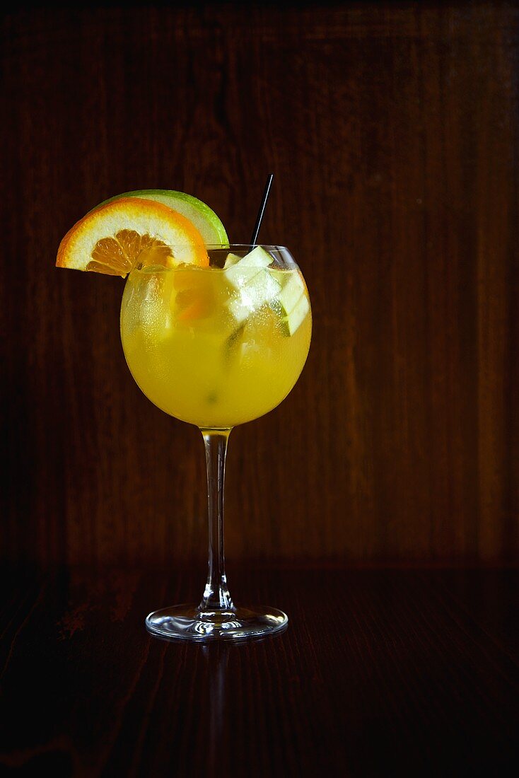 Glass of White Sangria with Fruit Slice Garnishes