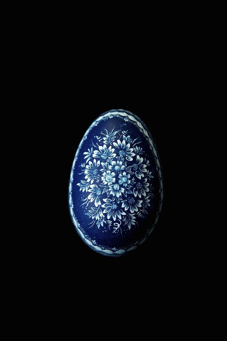 Blue Polish Painted Easter Egg on Black Background