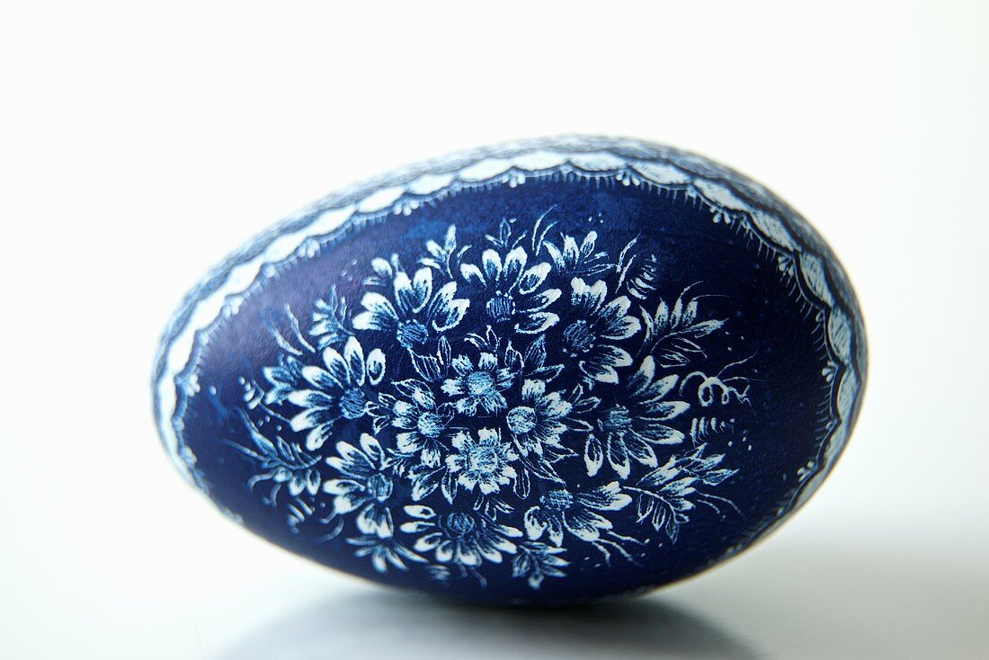 Blue Polish Painted Easter Egg; White Background