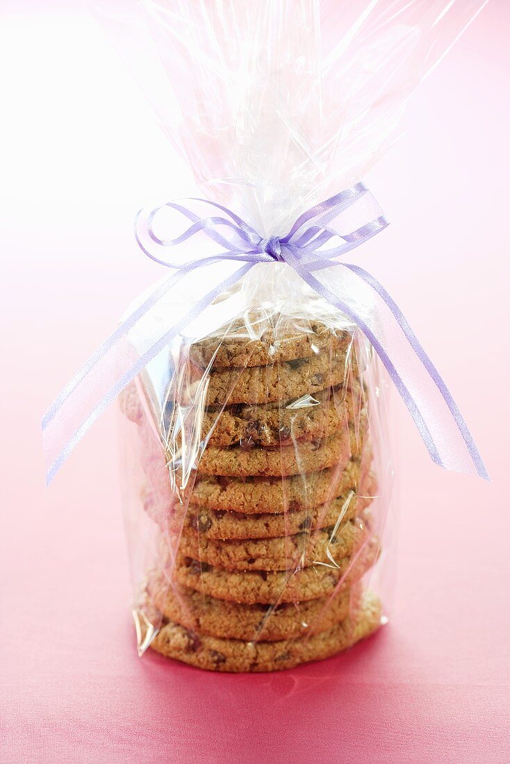 Homemade Oatmeal Raisin Cookies Wrapped in Clear Plastic Tied with a Ribbon