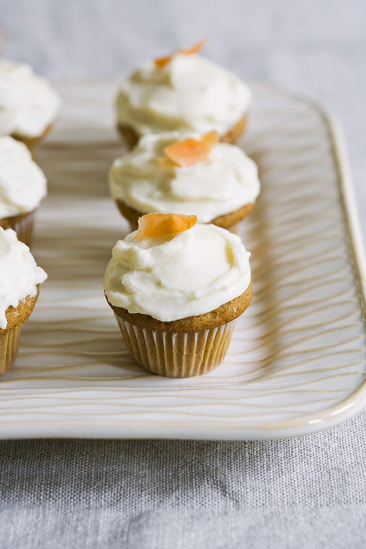 Carrot Cupcakes with Cream Cheese Frosting; On Platter