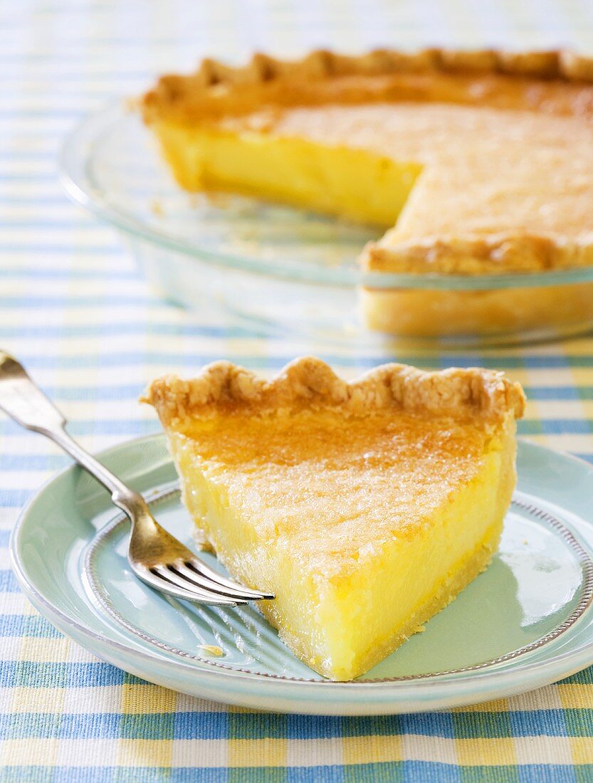 Slice of Lemon Chess Pie on a Blue Plate