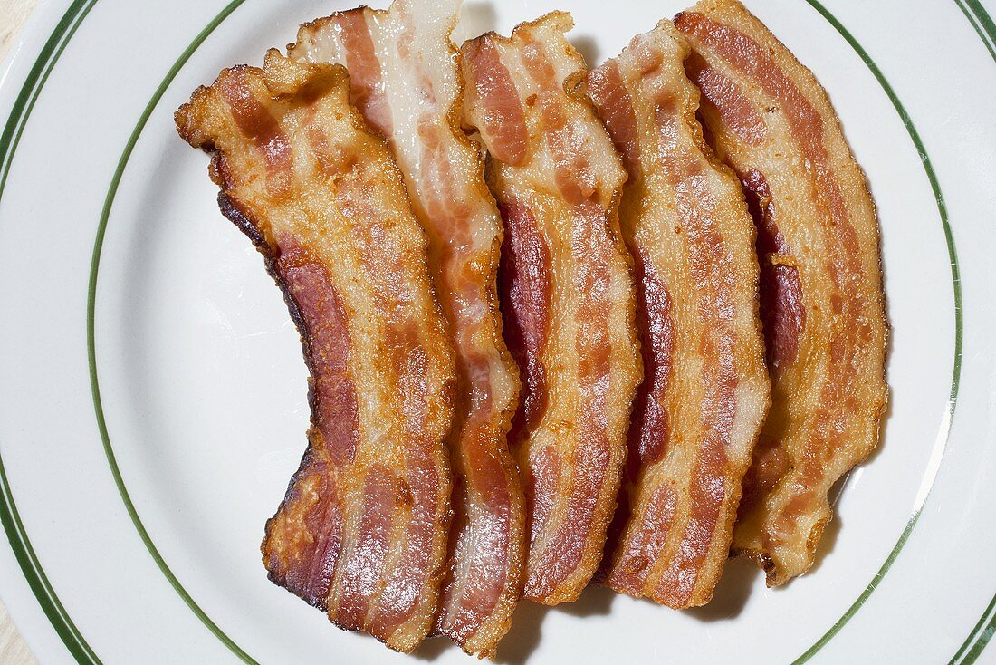 Plate of Cooked Bacon Strips; From Above