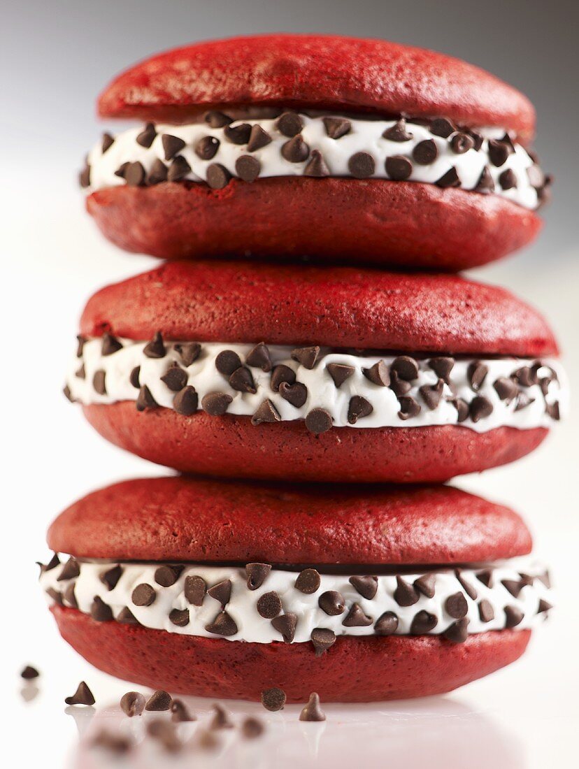 Three Red Velvet Whoopie Pies with Chocolate Chips Stacked