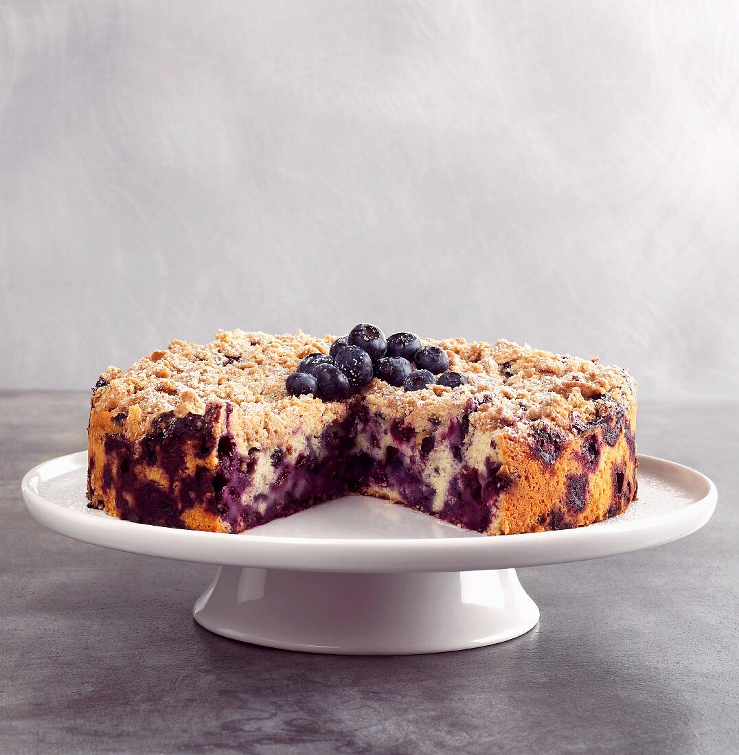Blueberry Buckle with Slice Removed on Cake Plate