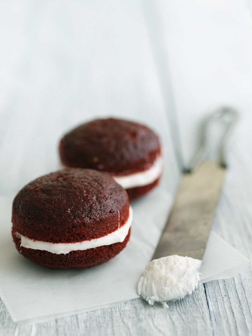 Two Red Velvet Whoopie Pies with Icing Spatula