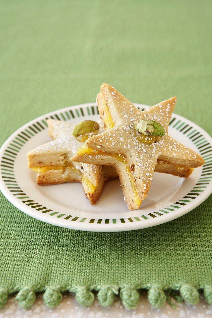 Two Star Cookies with Pistachios on a Plate