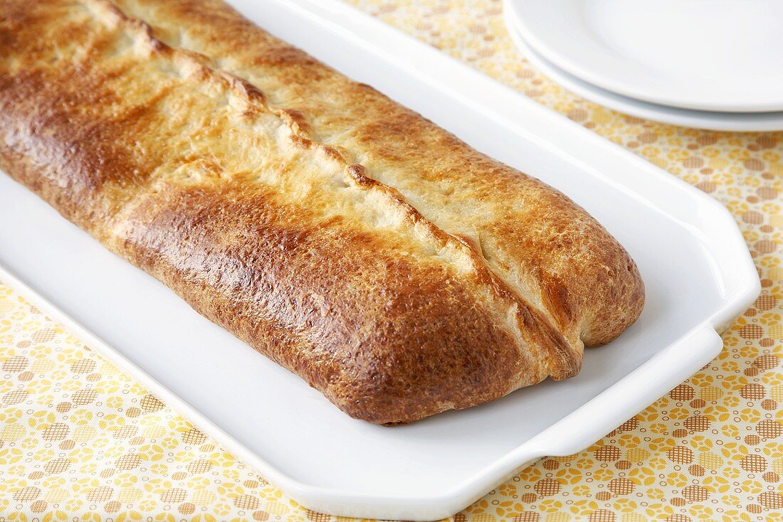 Whole Stromboli on a White Platter