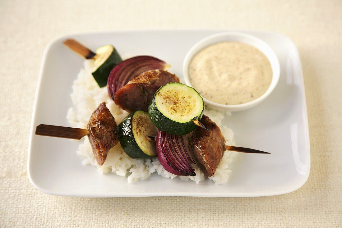 Sausage Zucchini and Onion Kabobs Over White Rice; Dipping Sauce