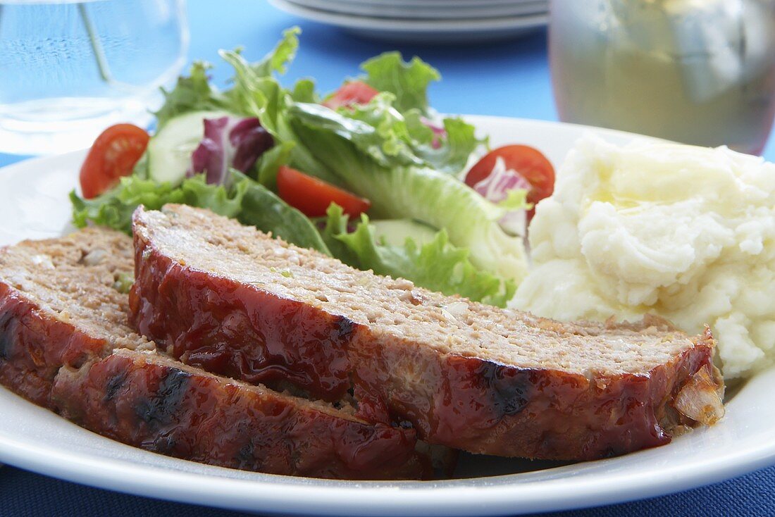 Dinner Plate of Meatloaf, Mashed Potatoes and a Salad