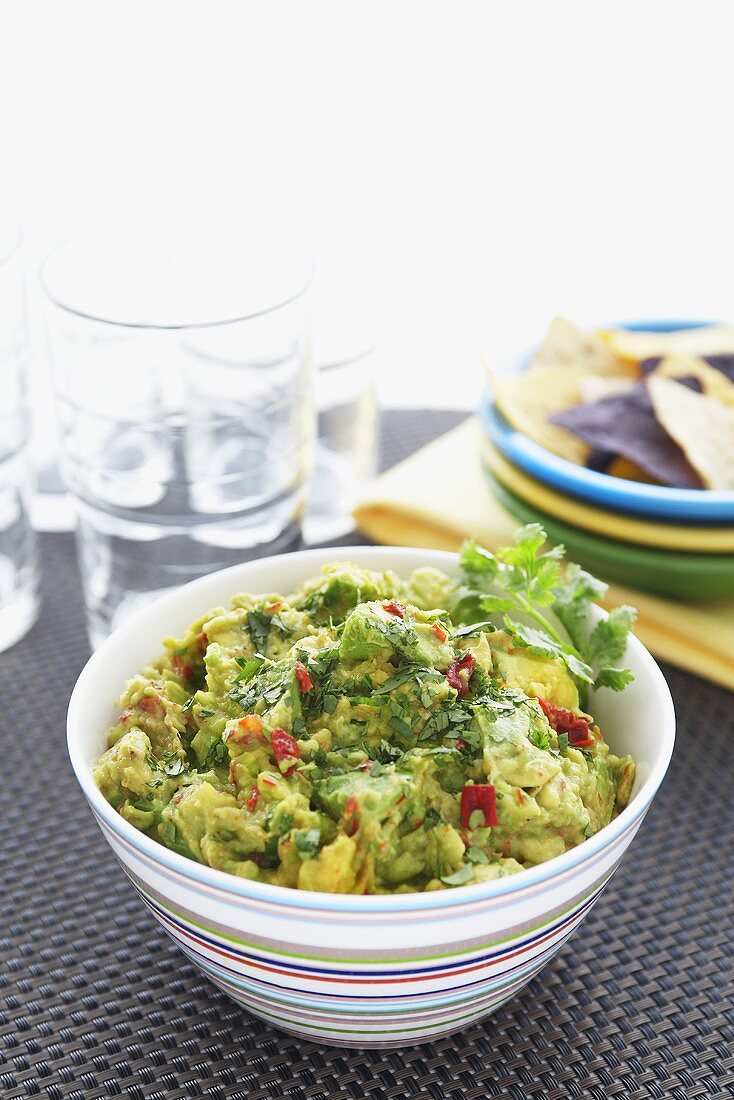 Bowl of Homemade Guacamole; Tortilla Chips