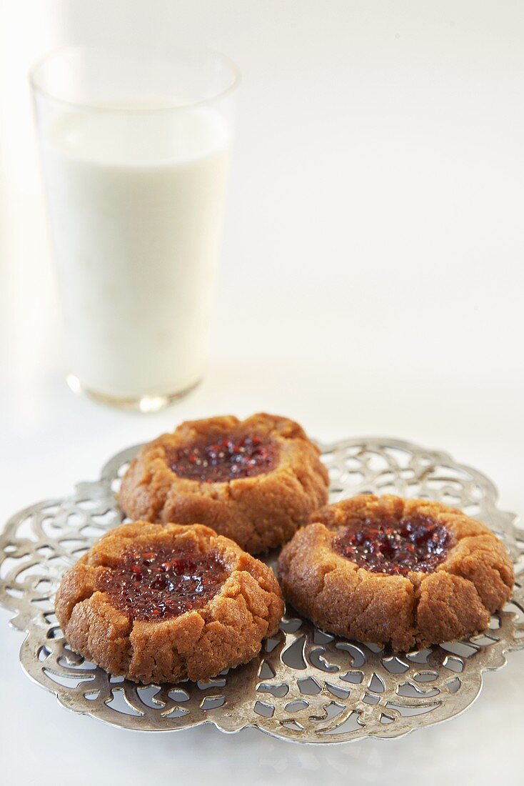 Peanut Butter and Jelly Cookies with a Glass of Milk