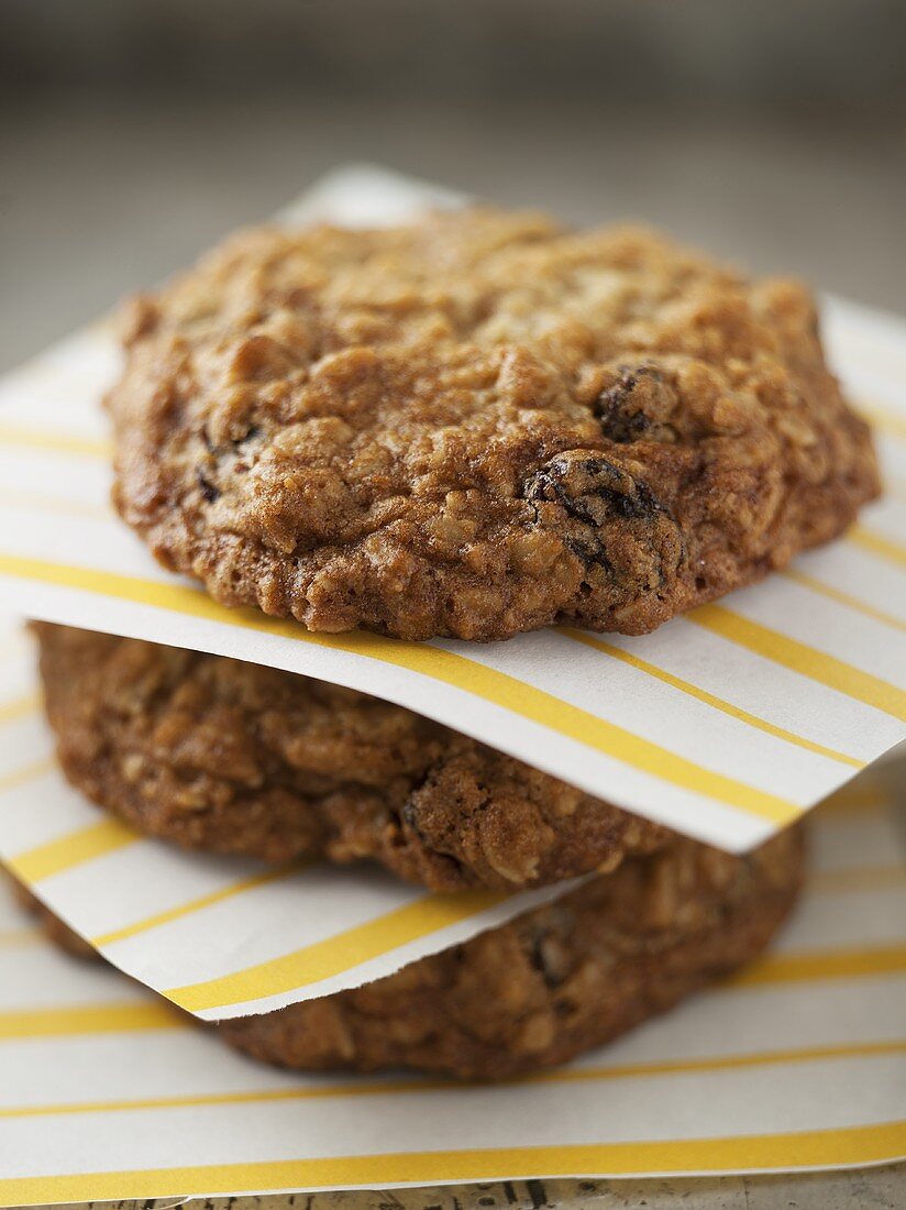 Stacked Oatmeal Raisin Cookies Stacked; Divided by Yellow Striped Paper