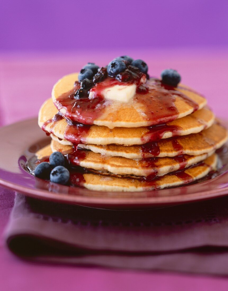 Stack of Pancakes with Butter and Blueberry Sauce
