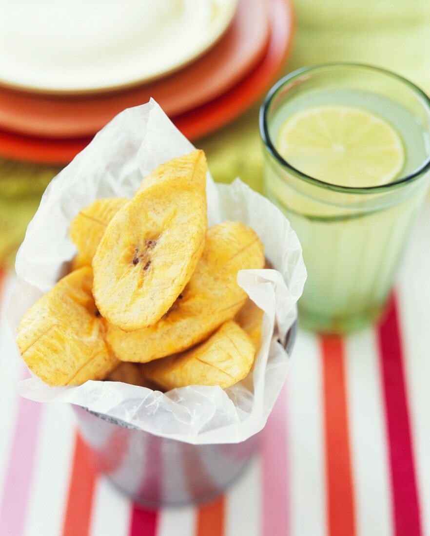 Banana chips and a glass of limeade