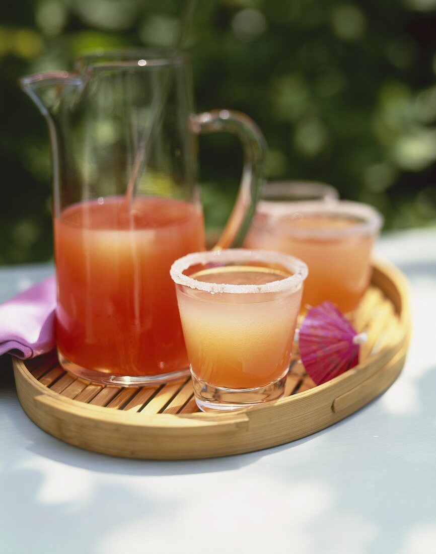 Grapefruit Margaritas on a Tray; In Glasses and a Pitcher