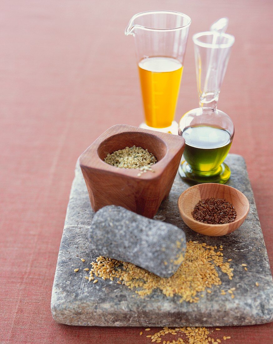 Flax and Hemp Seeds on Stone with Oils
