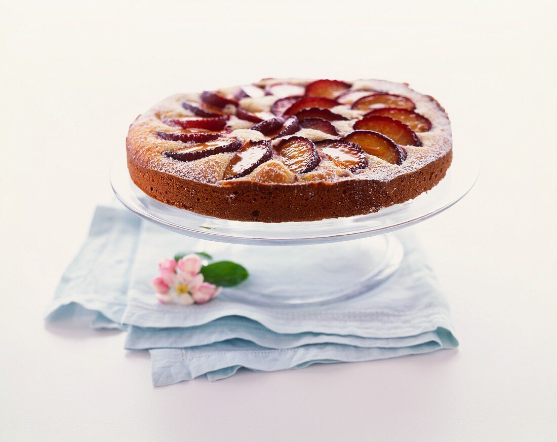 Whole Plum Tart on a Cake Stand