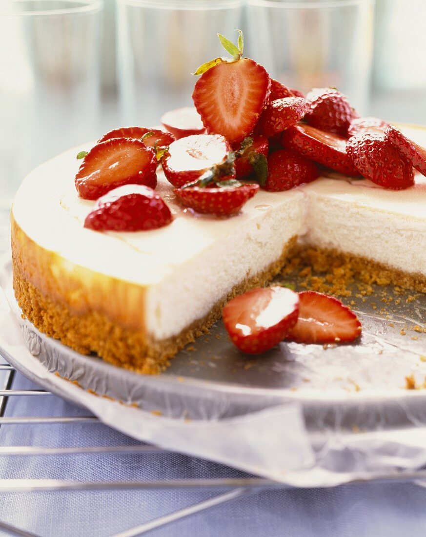 Cheesecake Topped with Sliced Strawberries; Slice Removed