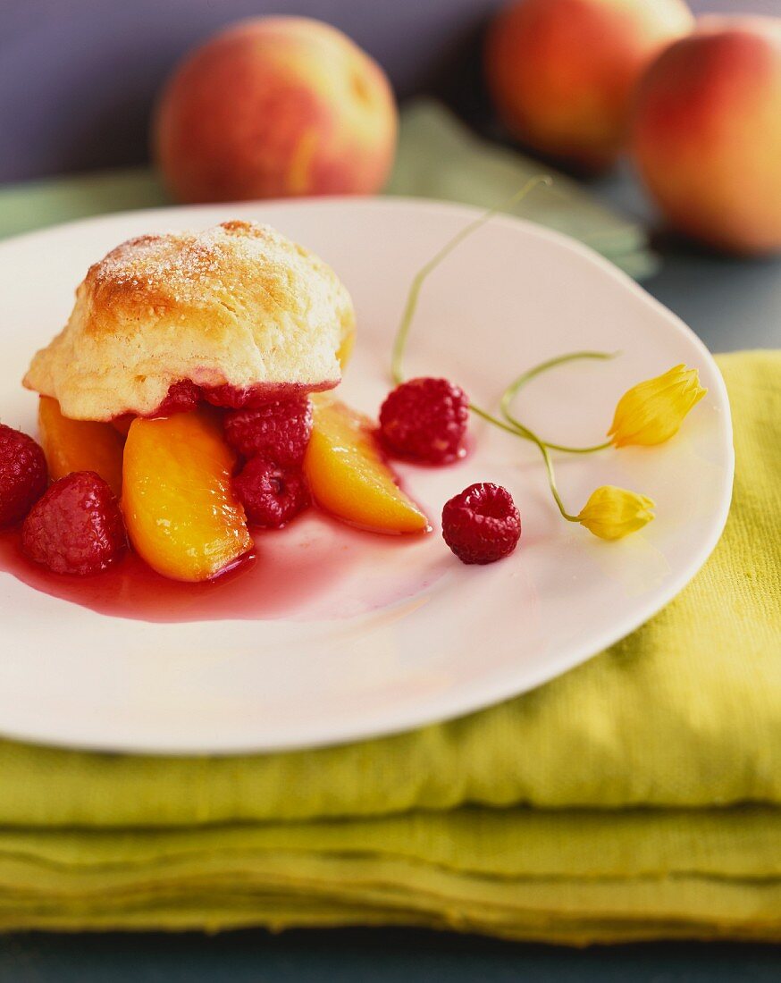A Serving of Peach and Raspberry Slump in a White Plate