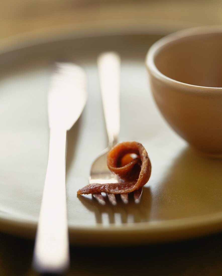 Anchovy Fillet Curled on a Fork