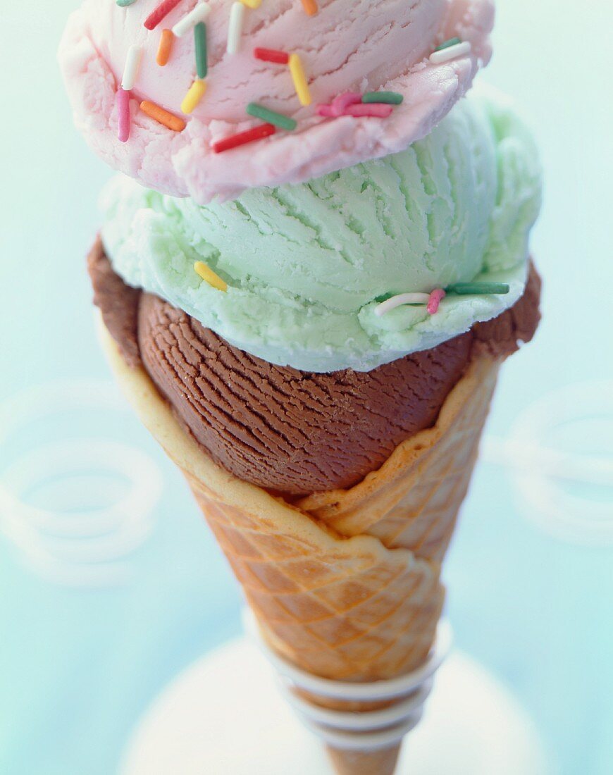 Waffle Cone with Three Scoops of Assorted Ice Cream Topped with Sprinkles
