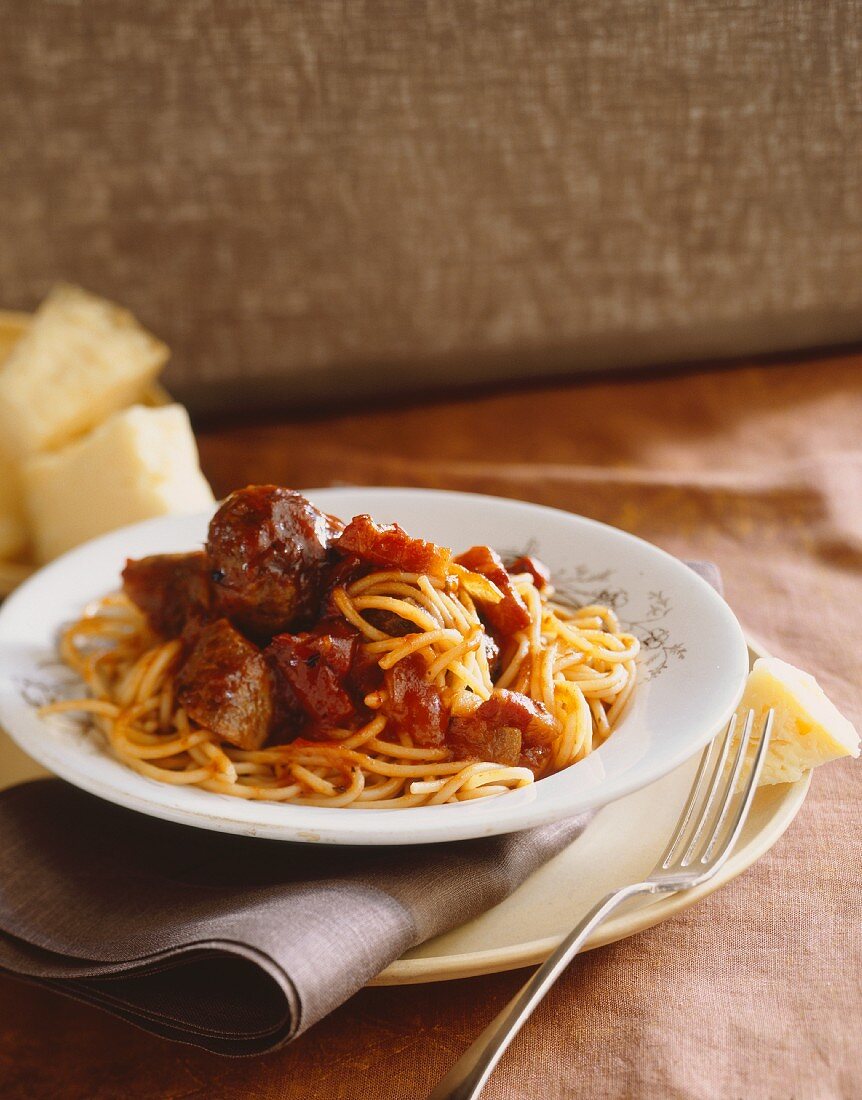 Plate of Spaghetti with Meatballs and Sausages in Tomato Sauce