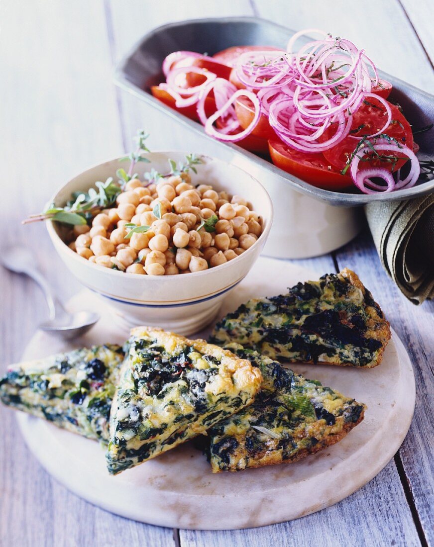 Spinach frittata, chickpeas and tomato and onion salad