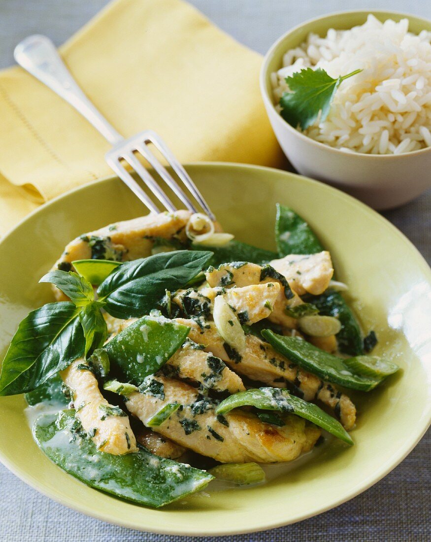 Chicken with basil and mange tout and a side of rice