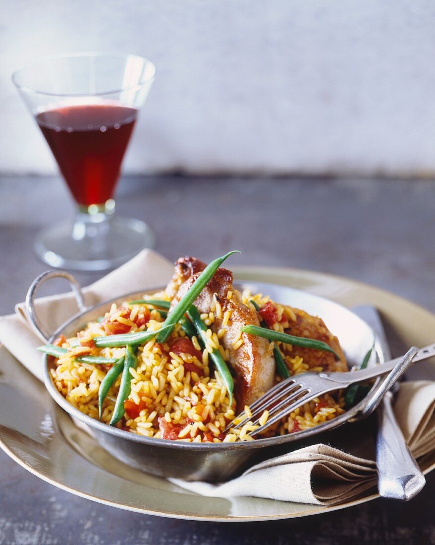 Pork chops with tomato rice and green beans
