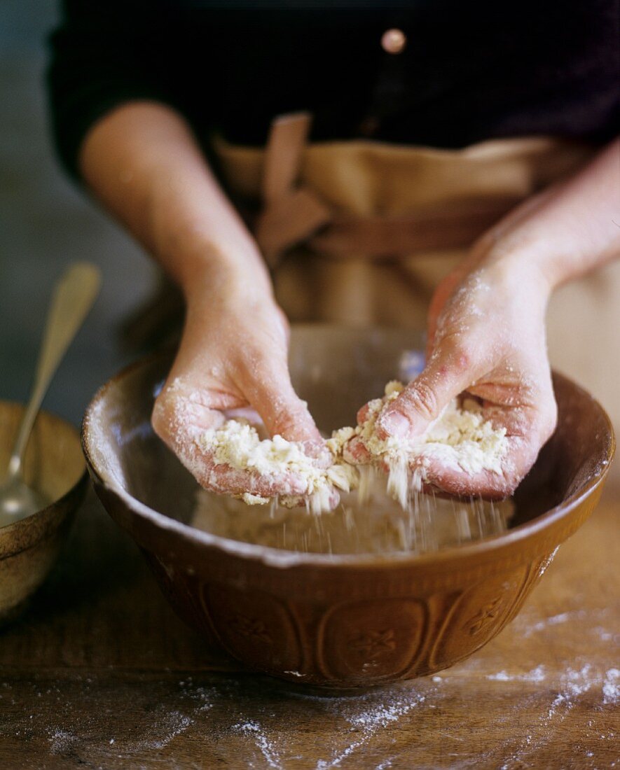 Hands Mixing Flour and Butter