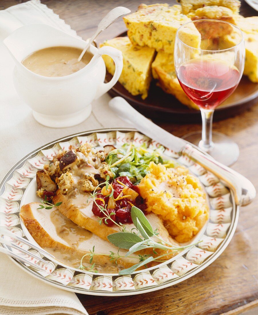 Roast Turkey Dinner Plate with Turkey, Sweet Potatoes, Cranberry Sauce and Stuffing; Gravy, Cornbread and Wine
