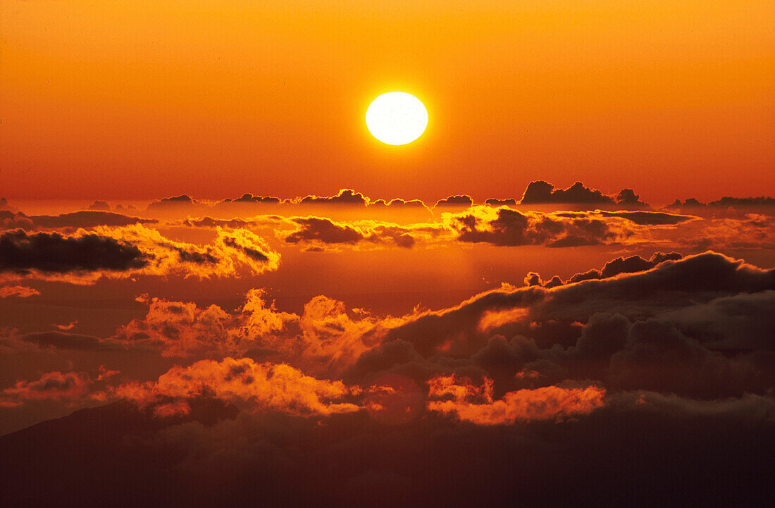Sunset over sea of clouds