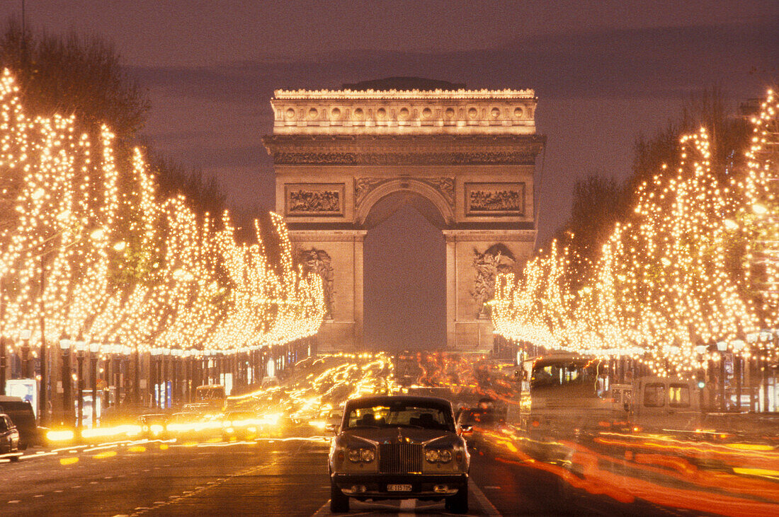 The illuminated Champs Elysees at night, Paris, France, Europe