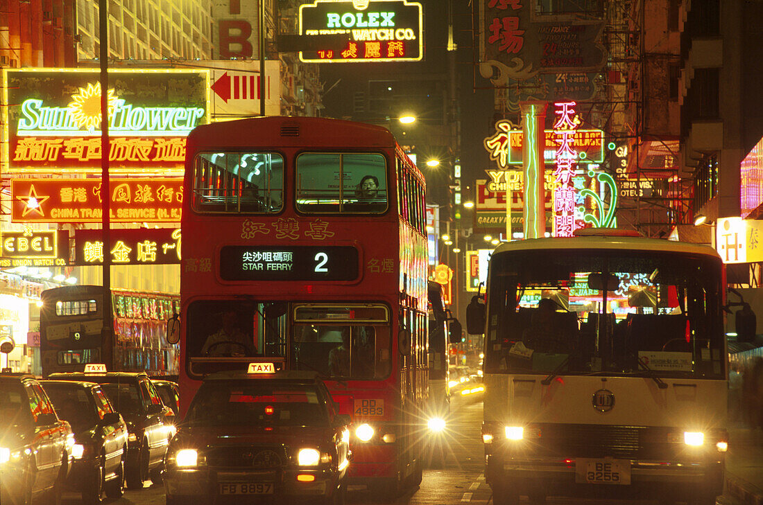 Neon signs and cars at Nathan Road at night, Hong Kong, China, Asia