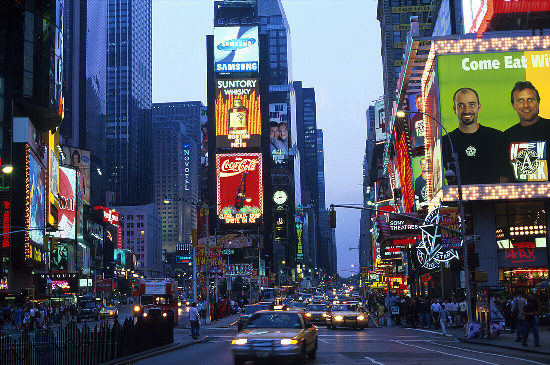 High rise buildings with neon signs and cars on the Times Square, Manhattan, New York, USA, America