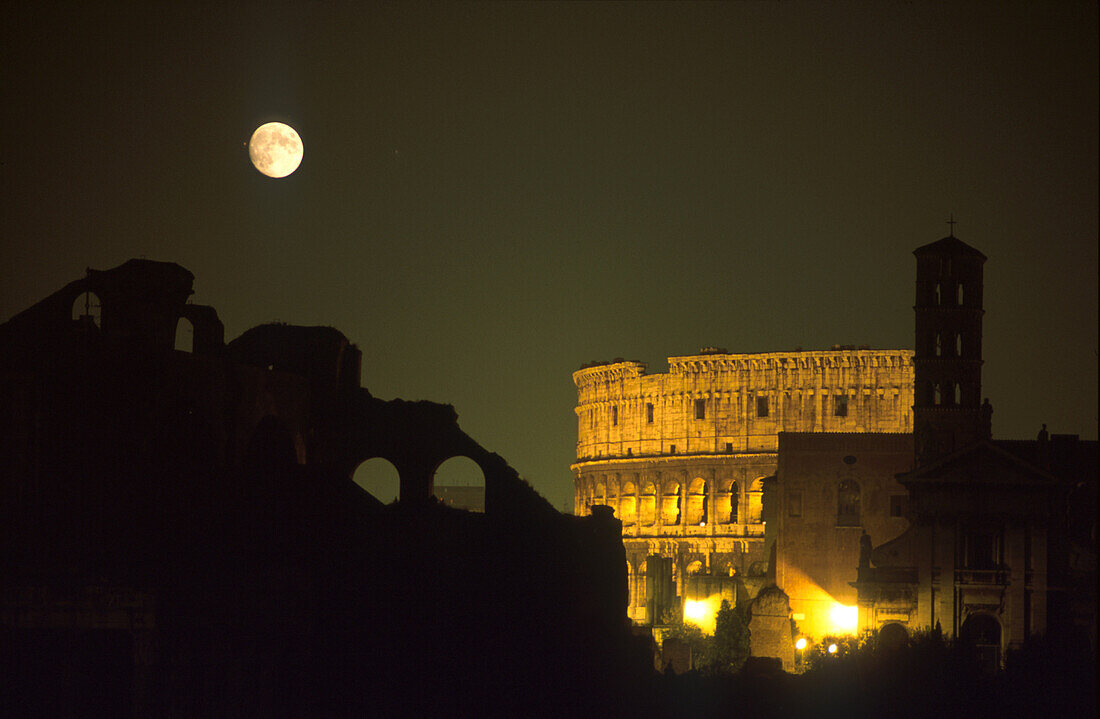The illuminated colosseum at full moon, Rome, Italy, Europe