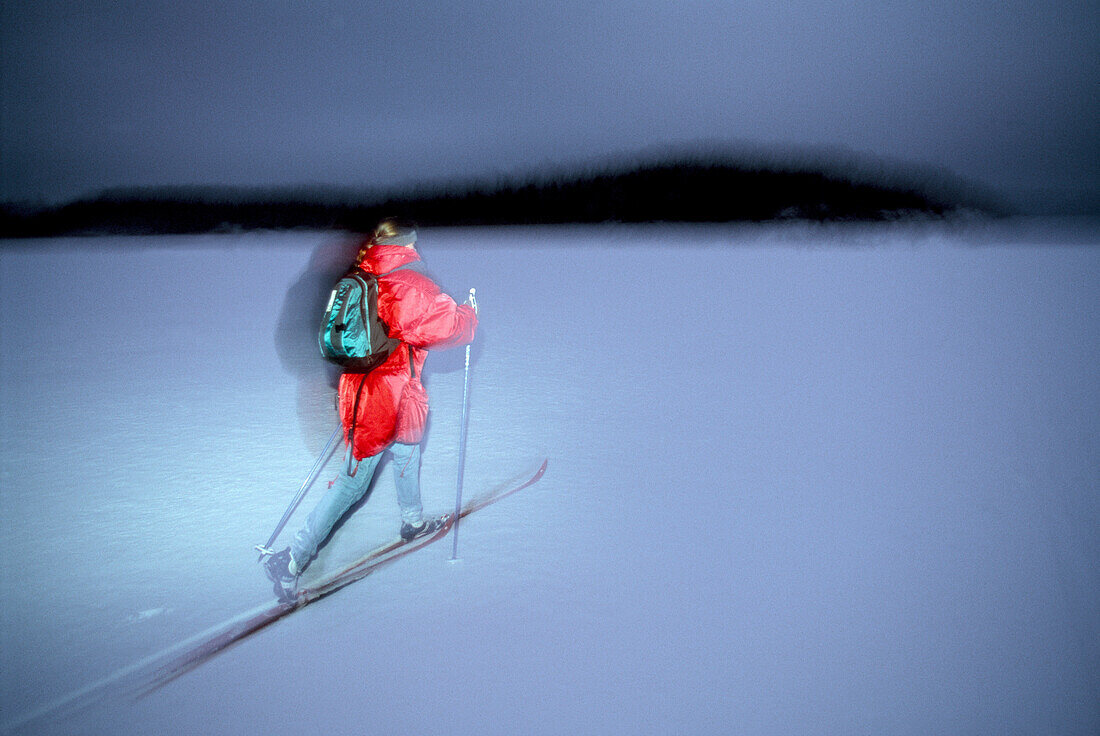 A person cross country skiing at night, Sweden