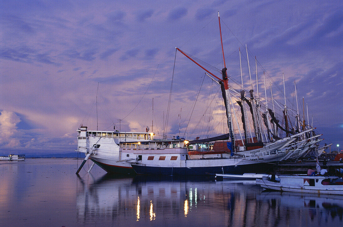 Ships in Paotere Harbour in the evening light, Ujung Pandang, Makassar, Sulawesi, Sunda Islands, Malay Archipelago, Indonesia