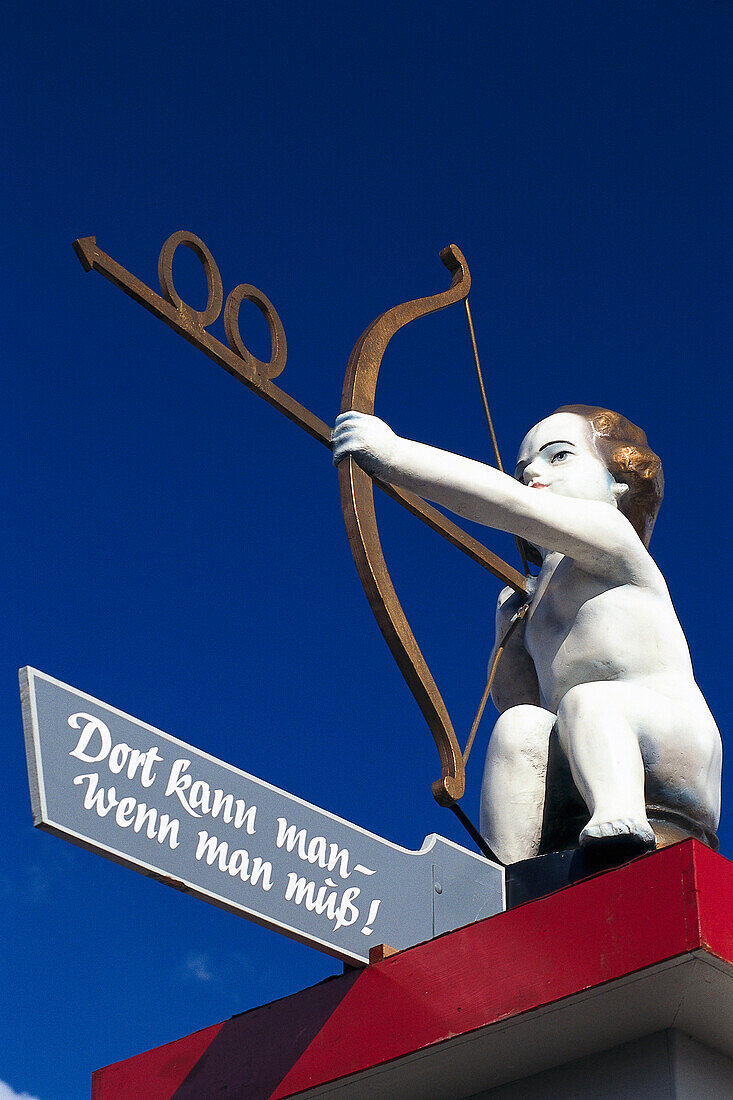Cupid as signpost, Oktoberfest, Munich