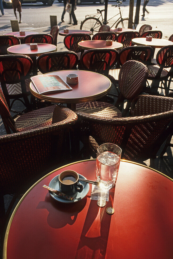 Table with a cup of espresso and a glass of water in a bistro, Karl Johaentges, Paris, France